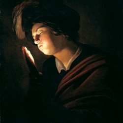 Boy blowing on an ember